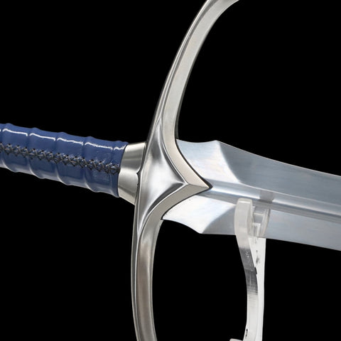 Close-up of a sword with a blue handle on a black background