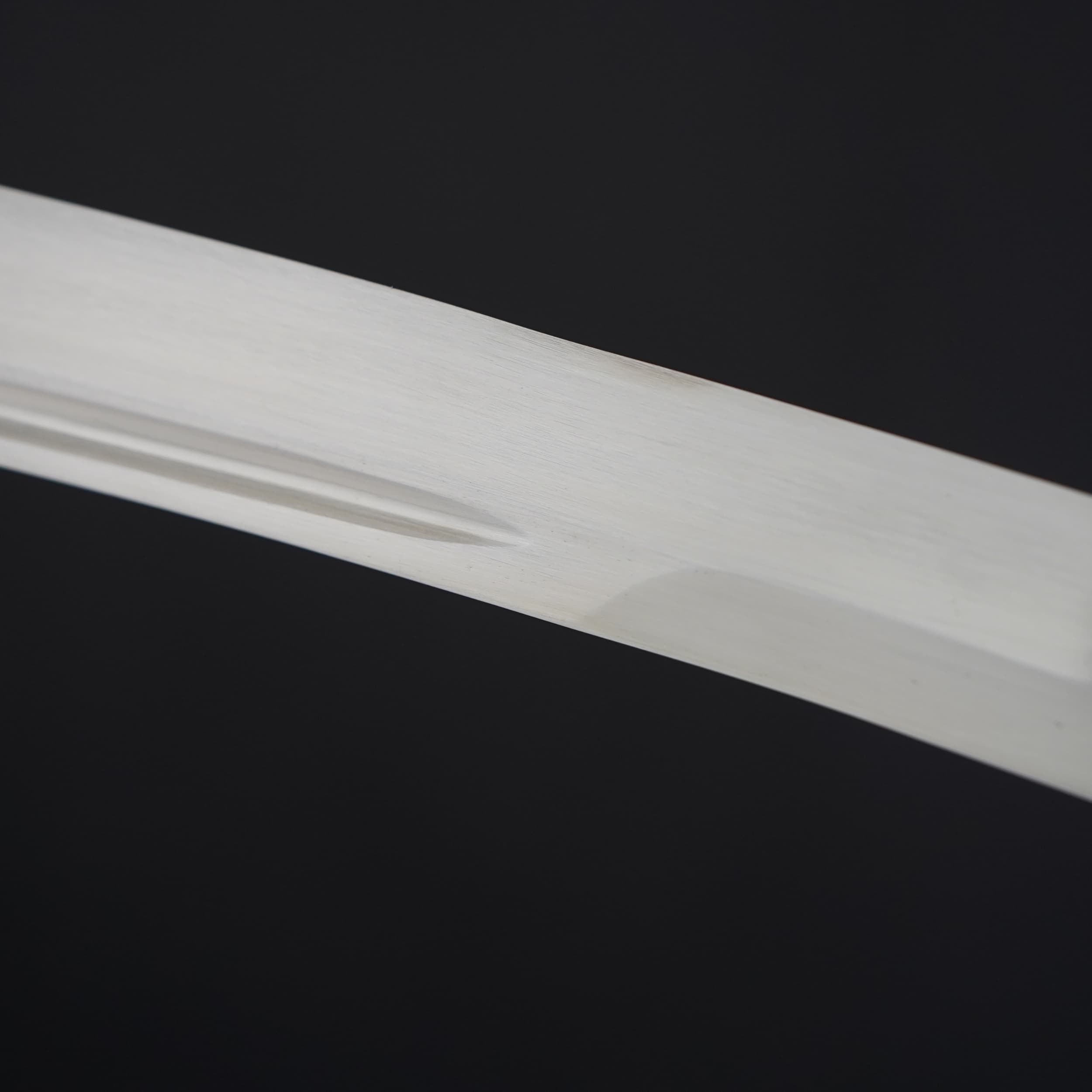 Close-up of a white rectangular object on a black background