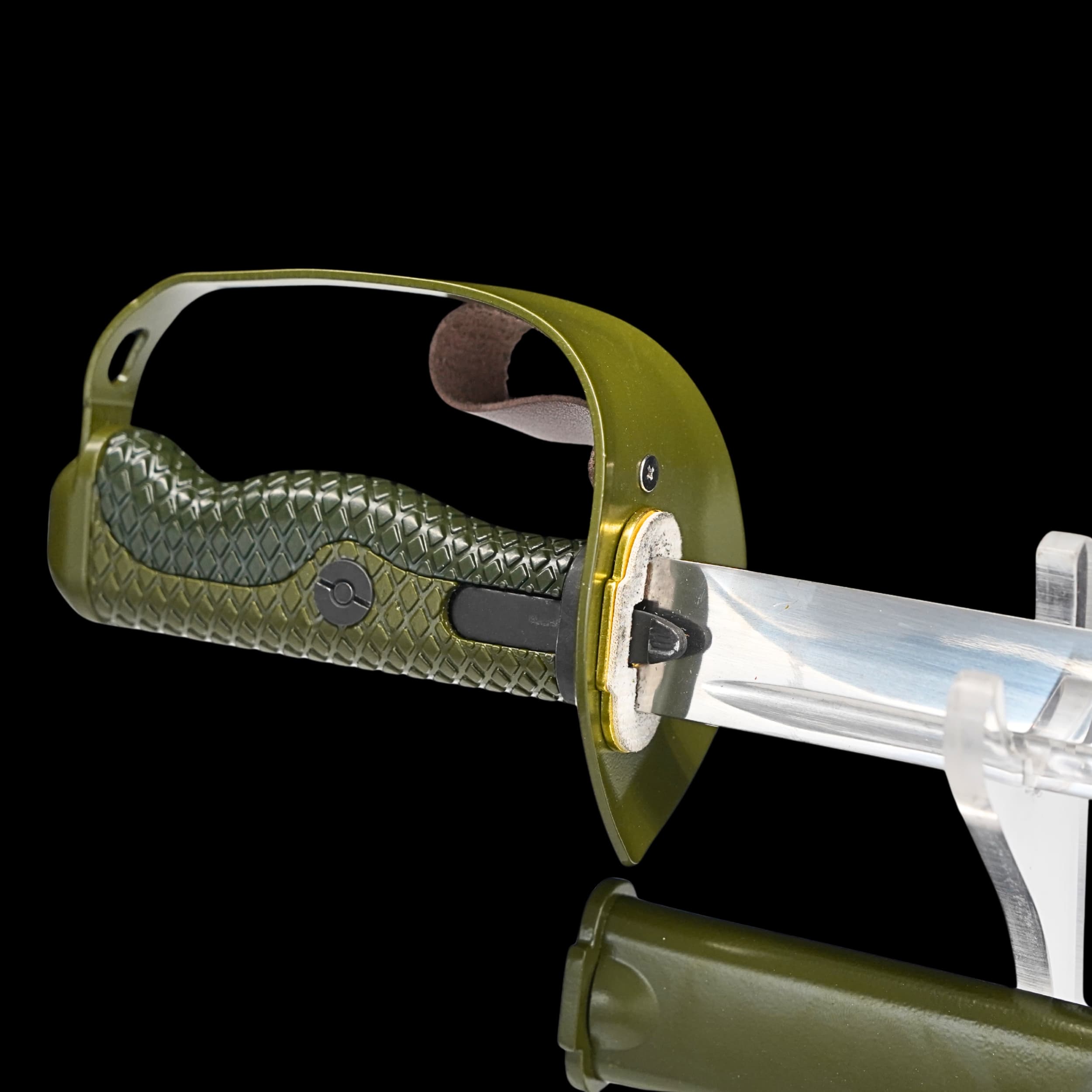 Sword with green handle and clear blade on a black background