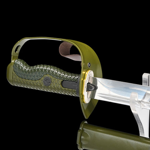 Sword with green handle and clear blade on a black background