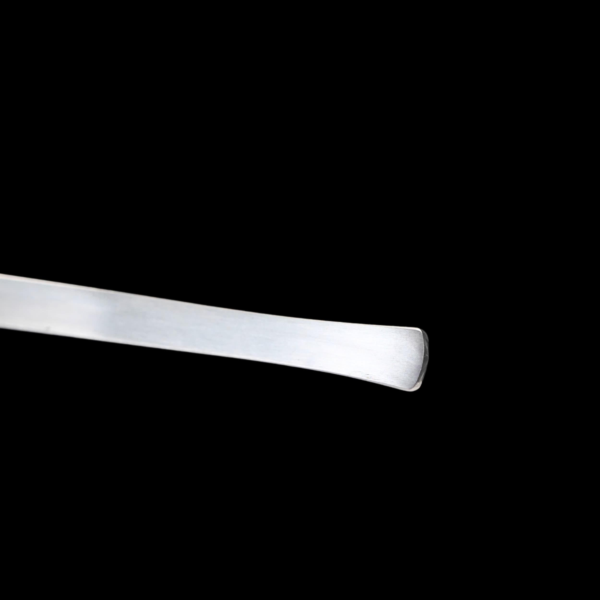 Metallic object on a black background
