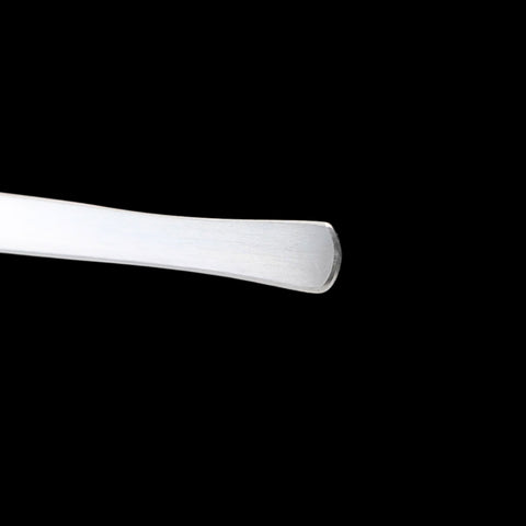 White cylindrical object on a black background