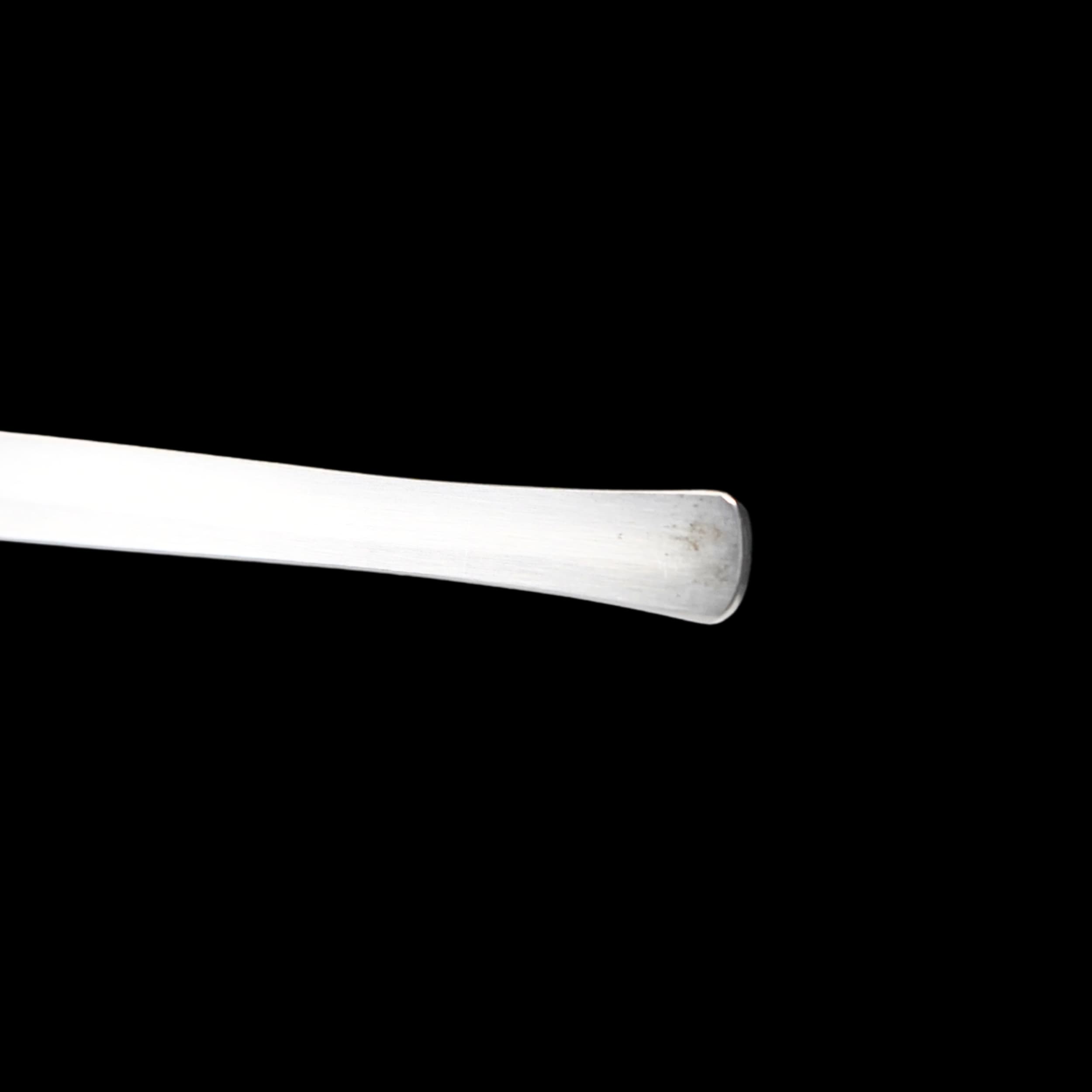 Metallic object on a black background