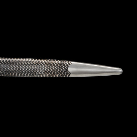 Close-up of a textured scabbard on a black background