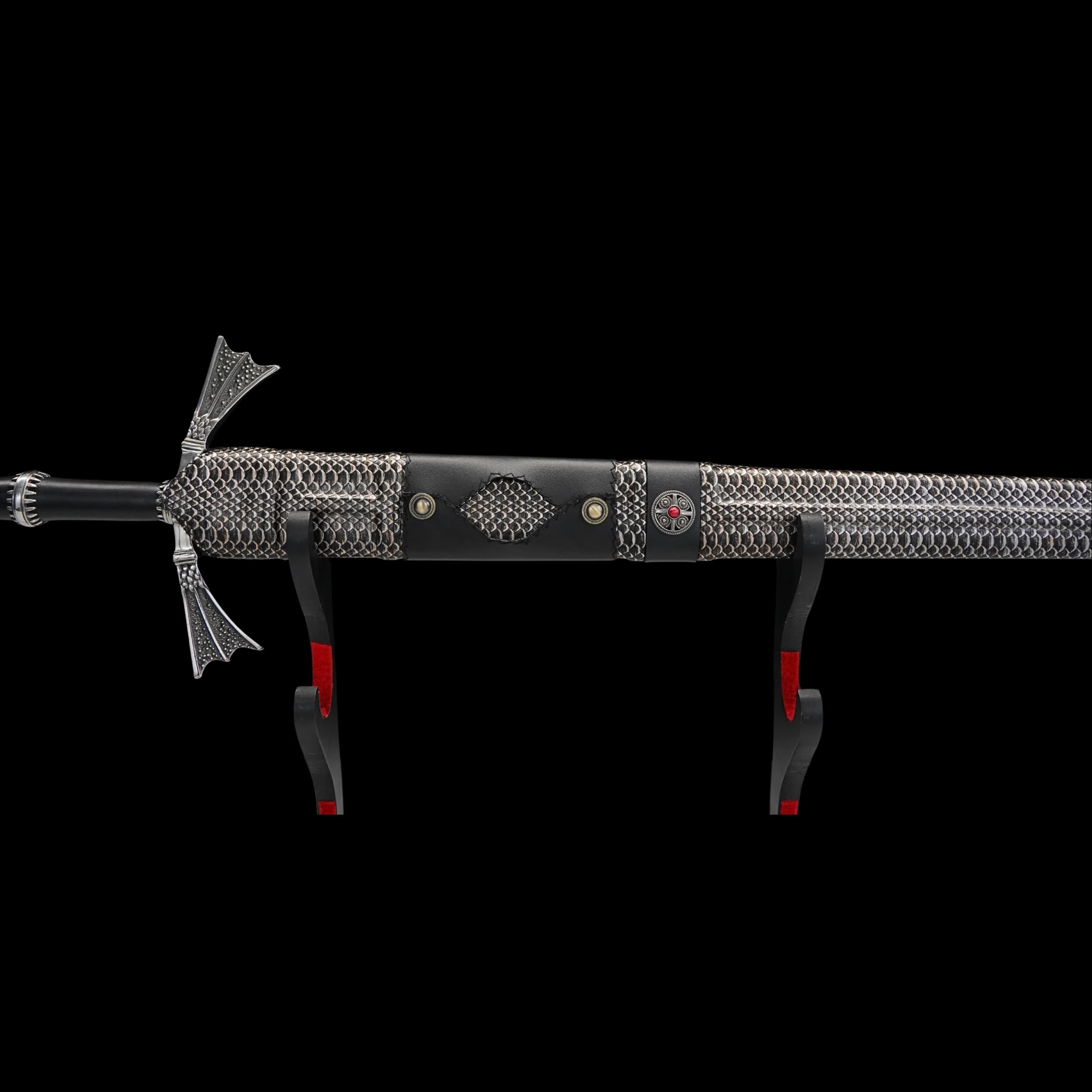 Decorative sword with chainmail design on a black background