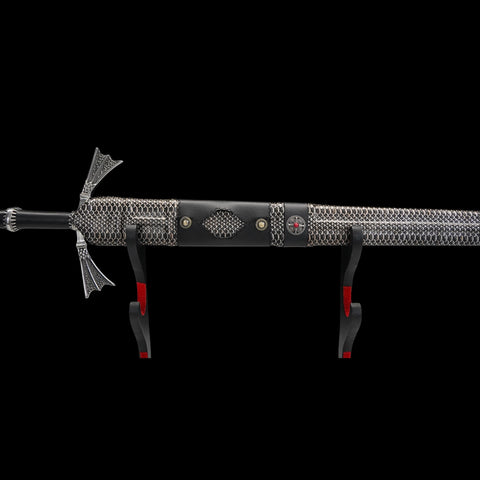 Decorative sword with chainmail design on a black background