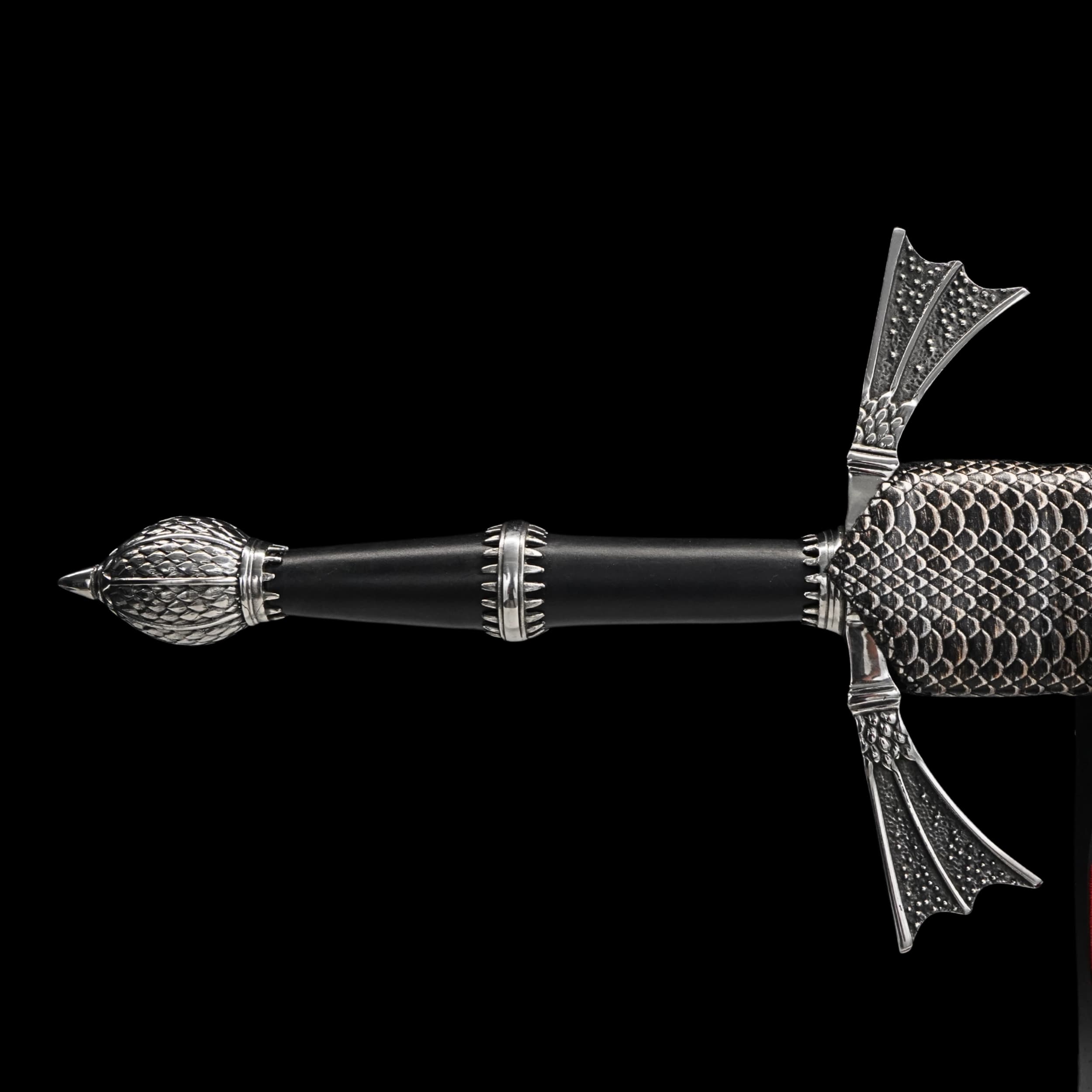 Decorative pen with intricate design on a black background