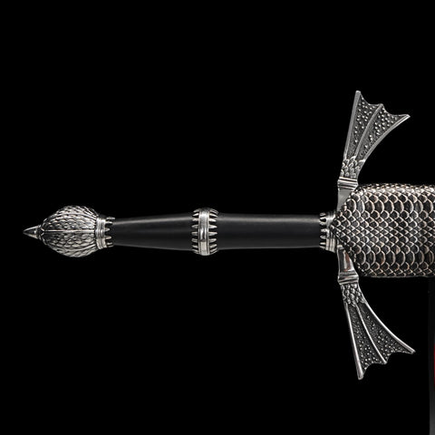 Decorative pen with intricate design on a black background