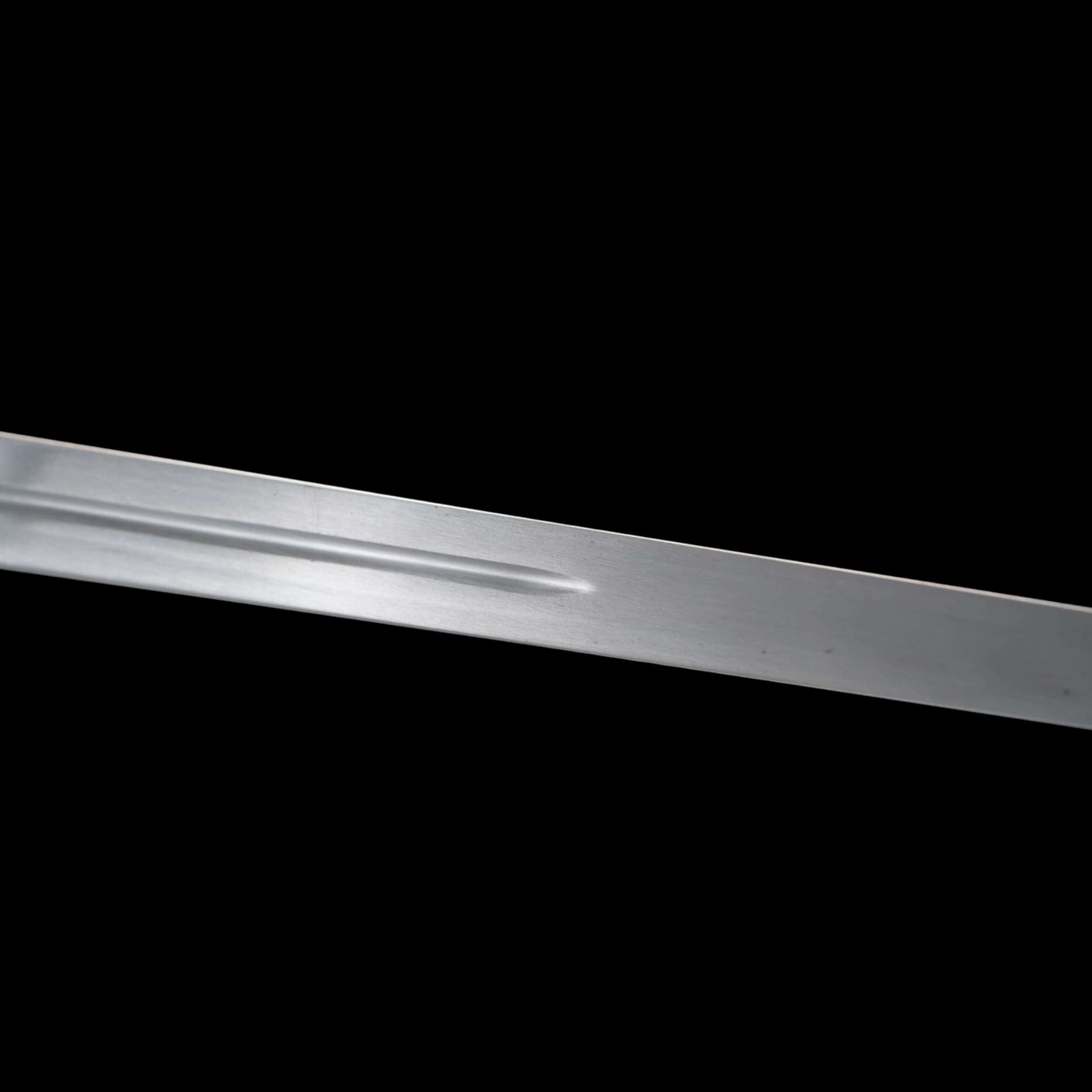 Close-up of a metallic object on a black background