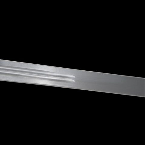 Metallic object with ribbed design on a black background