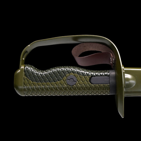 Close-up of a green and brown textured product with a metallic handle on a black background