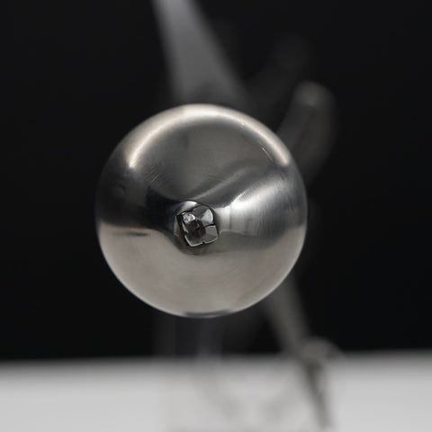 Close-up of a metallic object with a blurred background