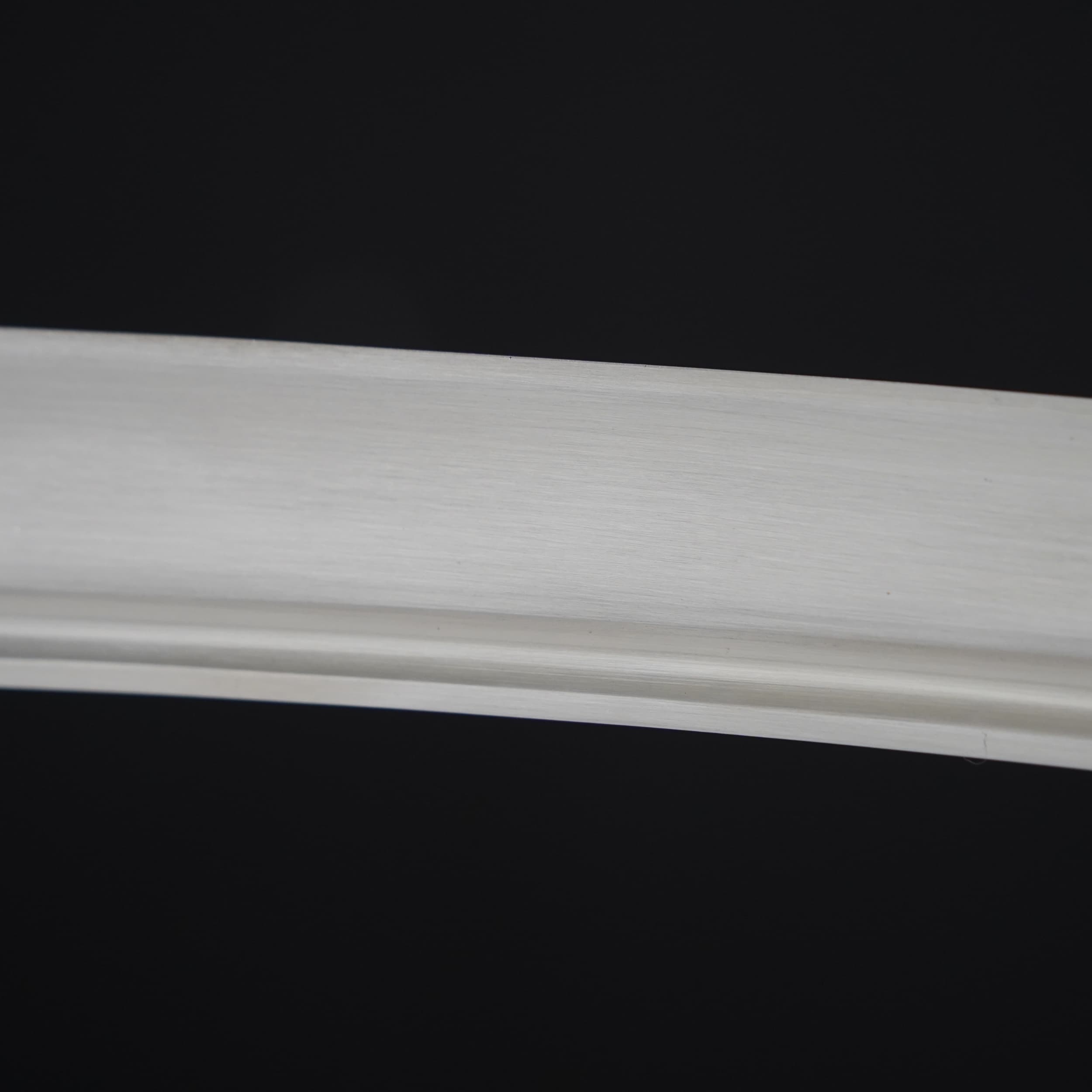 White crown molding on a black background
