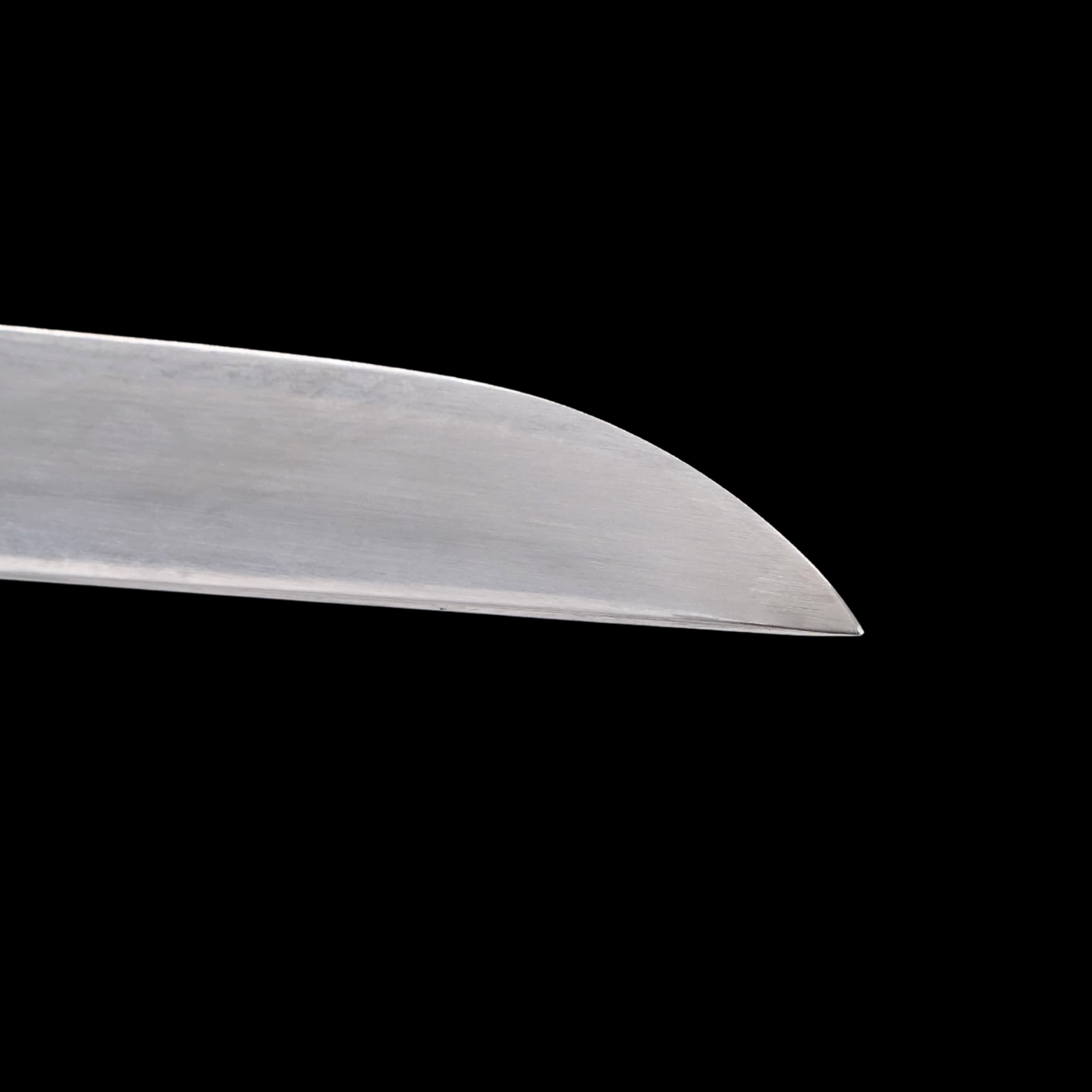 Close-up of a sword blade on a black background